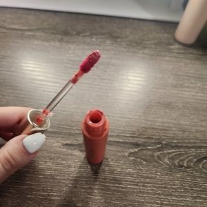 rare beauty lip gloss in shade happy